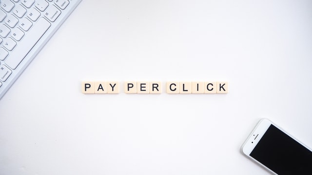 Pay Per Click in tiles with a phone and keyboard